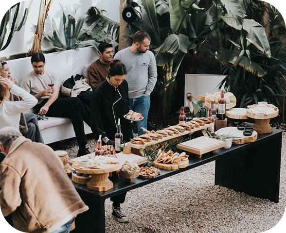 Team enjoying an office gathering with food and drinks